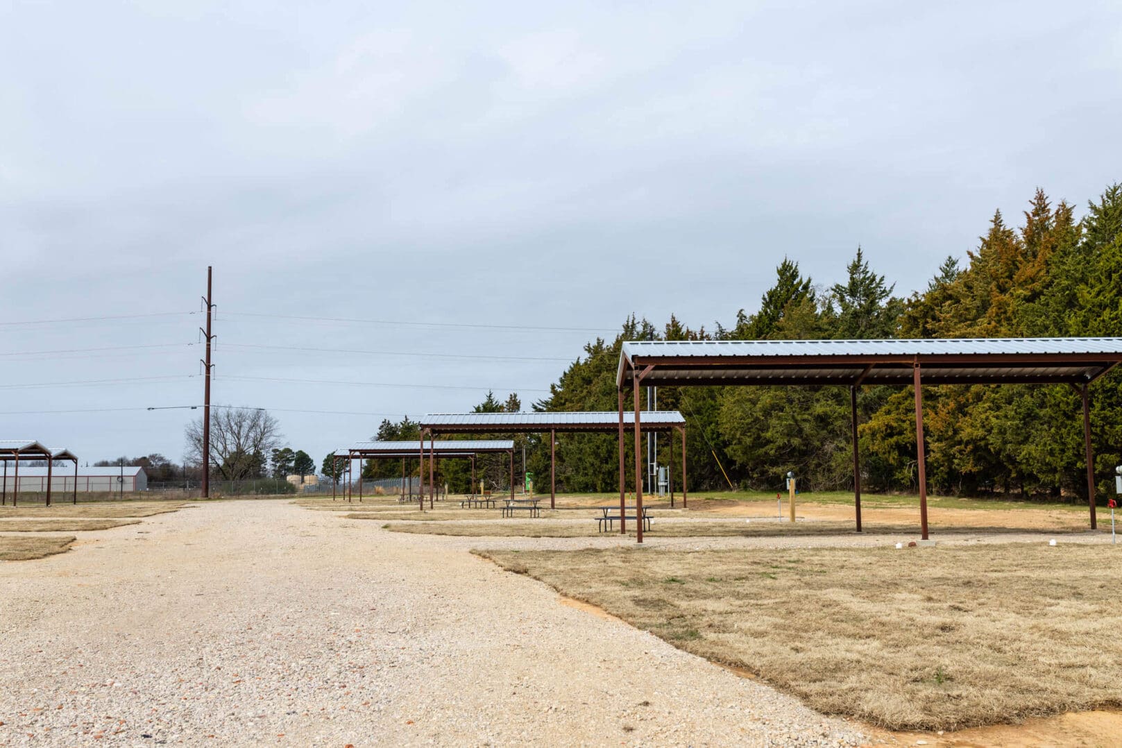 Empty RV campground with metal carports
